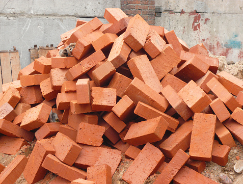 heap of red brick at day