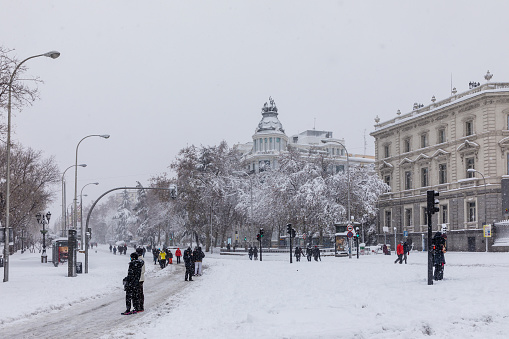 people enjoying the streets of snow, in the city of Madrid, covered by the storm philomena, january 05, 2021 in Madrid