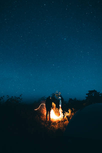 istock Camping in a Tent Under the Stars And bonfire 1296285045