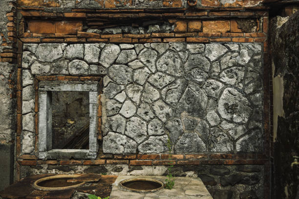 Abandoned Swiftlet Birdhouse Building with Concrete Walls and Tropical Surroundings
