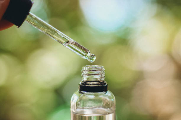 istock Herbal essence dropper into bottle close up 1296287145