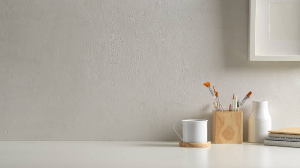 istock Workspace in home office room with copy space, supplies, cup and decorations 1296287146