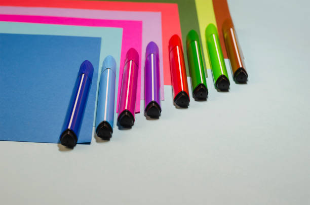 istock Creative geometric composition with colorful felt-tip pens and colored paper. 1296289101