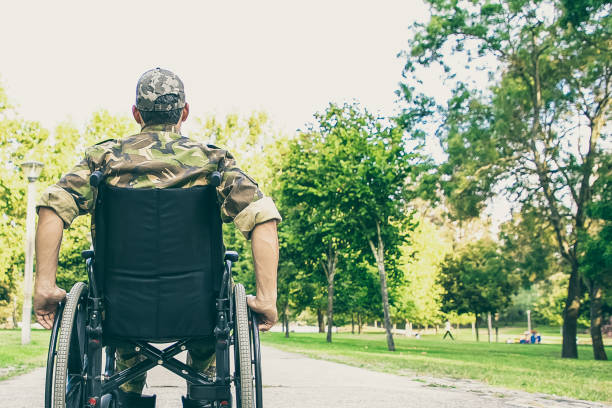 istock Single disabled retired military man in wheelchair 1296290220
