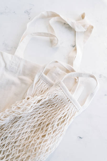 istock Eco cotton and net shopping bag on white background. 1296290775