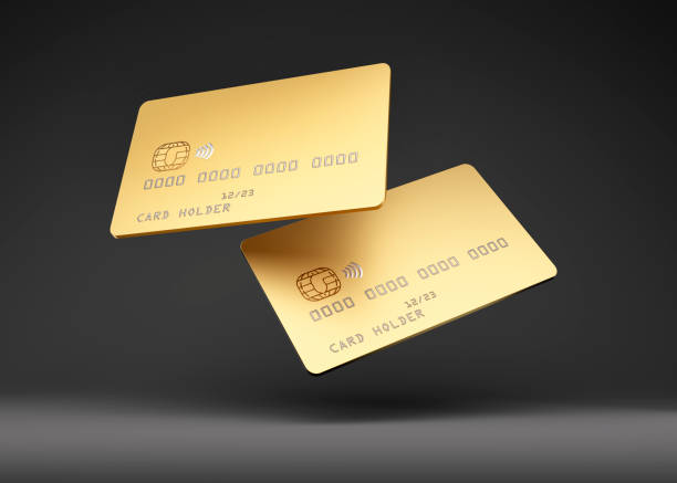 Golden Credit Card Mock up Golden glossy credit or smart card samples with emv chip on dark background atm photos stock pictures, royalty-free photos & images