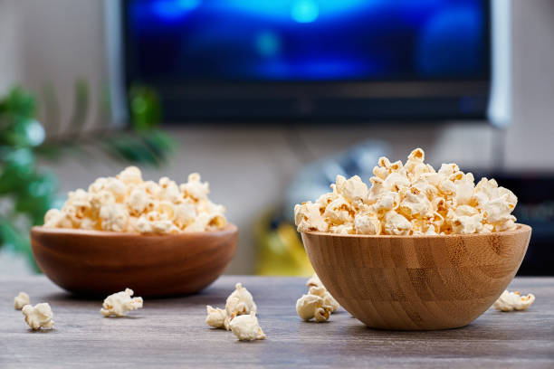 istock Two wooden bowls with fresh popcorn 1296294390