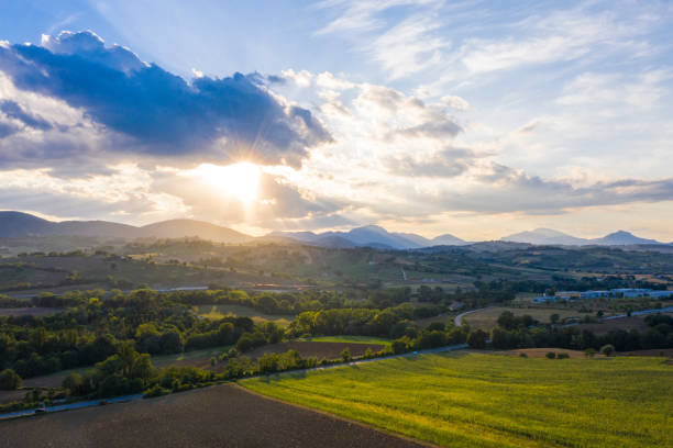 Aerial view of scenic summer sunset in the countryside of the Italian Marche region