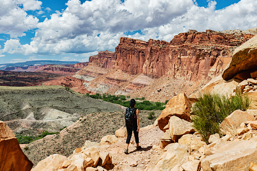 Under Corona arch: Woman hiking near Canyonlands, Moab