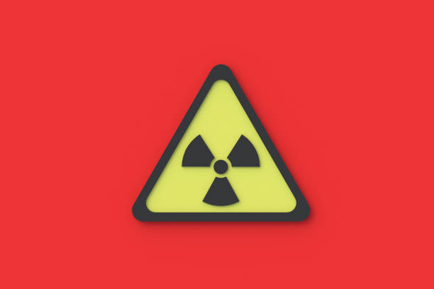 istock Sign of radiation hazard on red background. Triangle form. Warning symbol. Top view. 3d rendering 1296301608