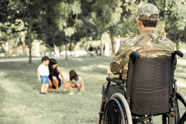istock Lonely disabled retired military man in wheelchair 1296301718