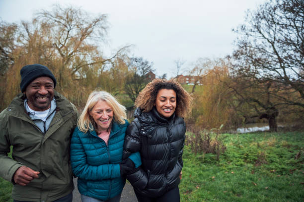 istock Family Morning Walk Through the Park 1296302246