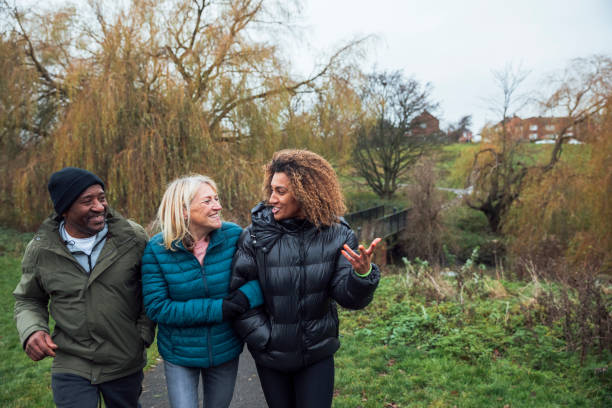 istock Family Walk Through the Park 1296302975
