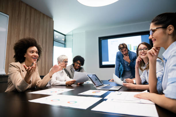 istock Happy diverse business colleagues meeting, working in modern office 1296303073