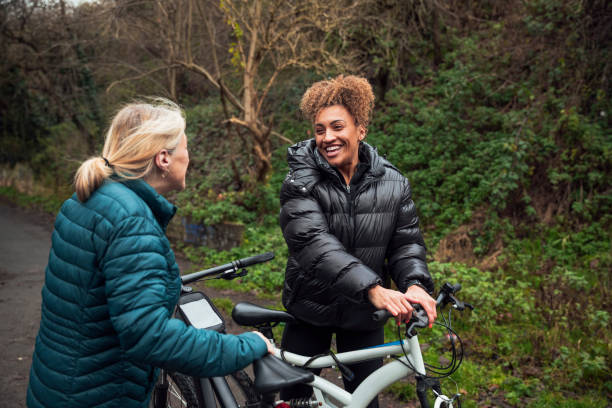 istock Mother and Daughter on a Ride Through the Park 1296303150