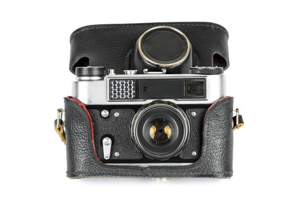 istock Vintage analog camera in leather case on white background 1296303323