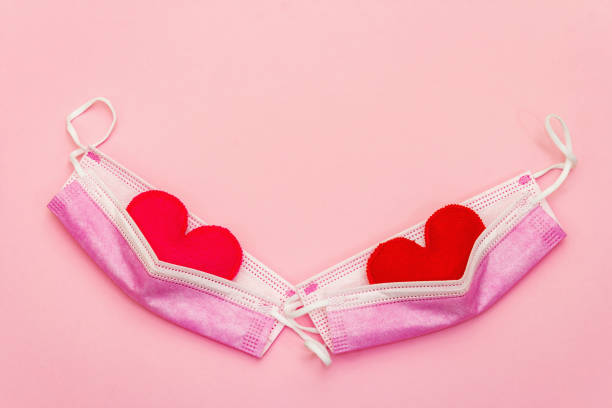 istock Red heart with medical protection mask 1296304454