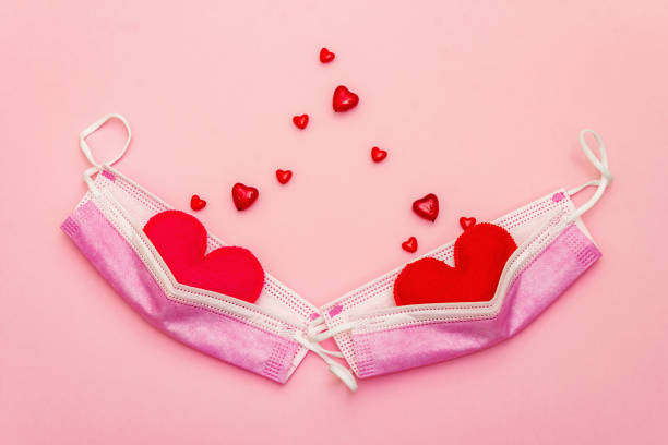 istock Red heart with medical protection mask 1296304561