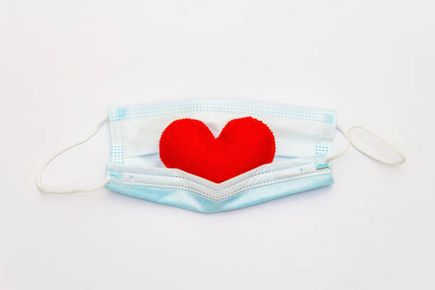 istock Red heart with medical protection mask 1296304792