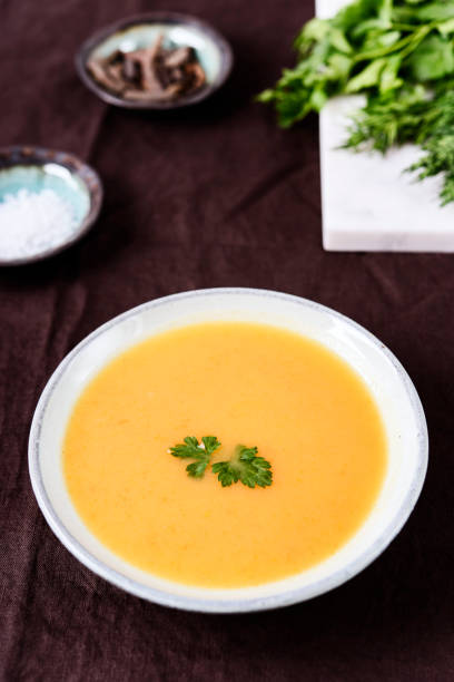 istock Healthy Vegetable Cream Soup in a bowl on linen tablecloth 1296307874