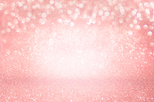 Macro photography of glitter. Soft pink background