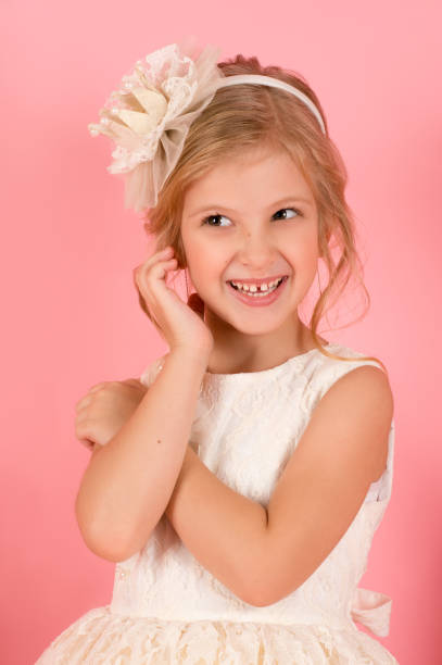 istock portrait little child isolated on pink background 1296309108