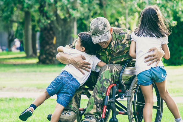 istock Happy disabled military man in wheelchair returning home 1296309507