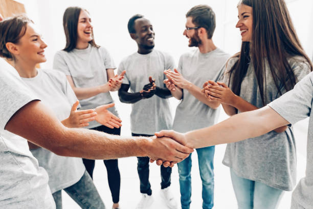 istock close up. the handshake of the delegates of the youth summit students 1296310607