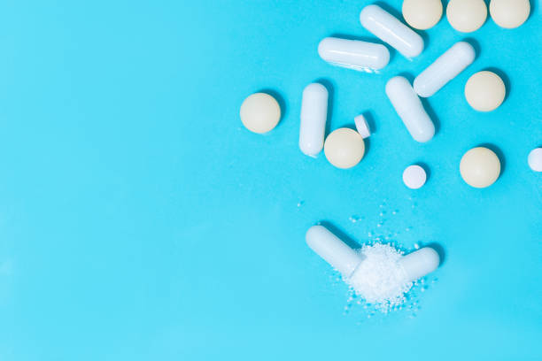 istock close up. capsules with medicine and tablets on the table 1296310706