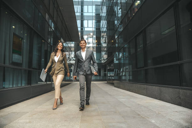 istock Businesspeople rushing to a meeting 1296311743