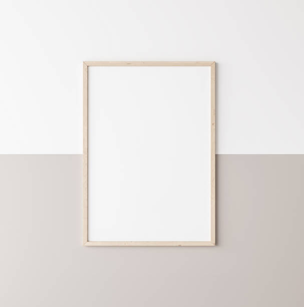 istock Mockup poster frame, vertical wooden frame on beige and white wall 1296312410