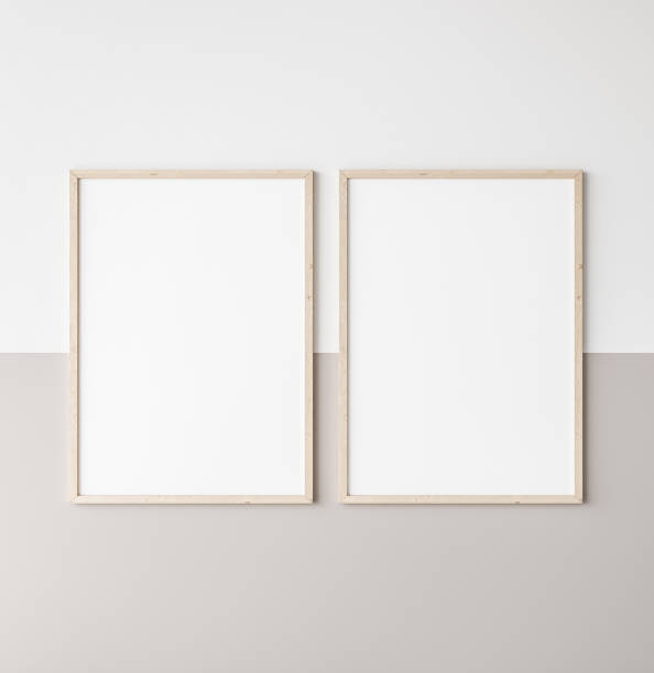 istock Mockup poster frame, two vertical wooden frames on beige and white wall 1296312421