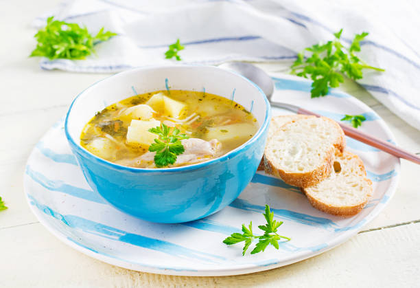 istock Chicken soup with noodles and vegetables in bowl. 1296313145