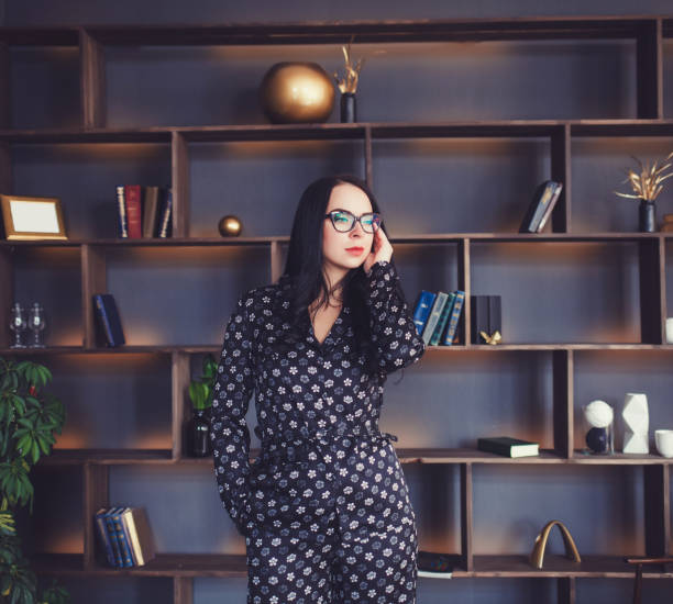 istock Confident brunette woman with glasses 1296313212