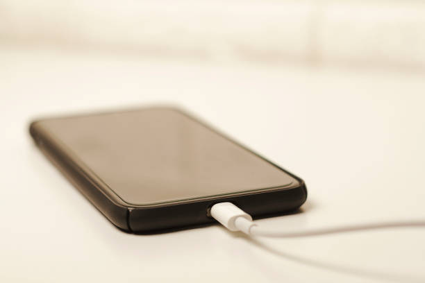 istock Charging mobile phone - Foto stock 1296313692