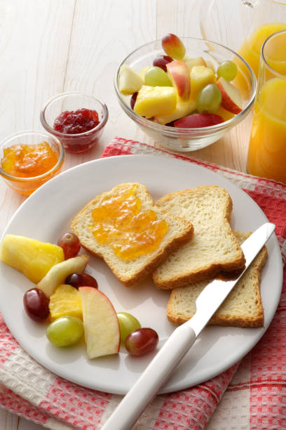 istock Breakfast: Toast, Fruit Salad and Orange Juice Still Life 1296315994