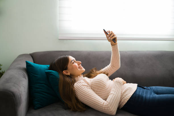istock Side view of a woman talking through a video chat 1296316222