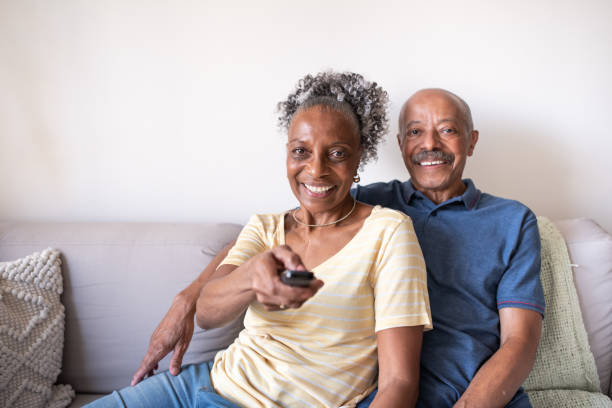 istock Senior couple watching TV 1296316625