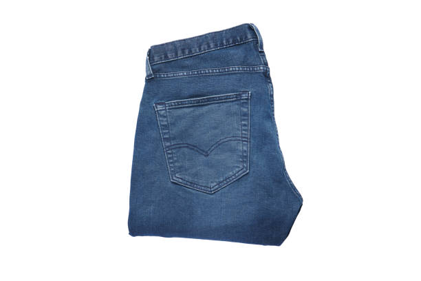 istock Jeans on a white isolated background, top view. Jeans on the background. 1296316795