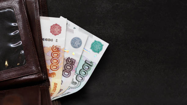 istock Russian rubles bills in a leather wallet, black background 1296321806
