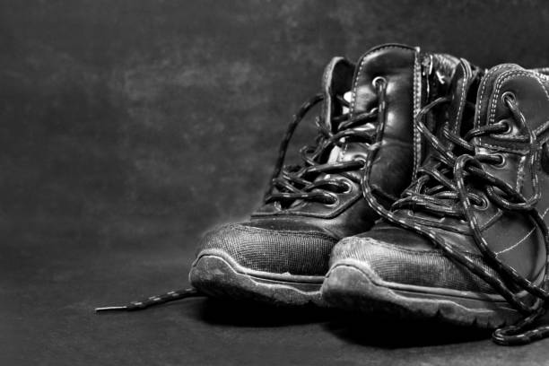 istock Old School Shoes for Little Boy. Black background. 1296321827