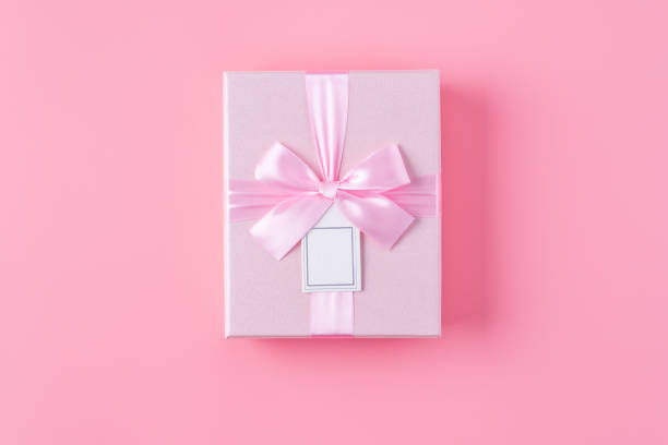 istock Valentine's Day design concept background with rose flower and gift box. 1296322583