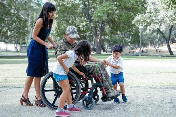 istock Disabled military father talking with cute children 1296323123