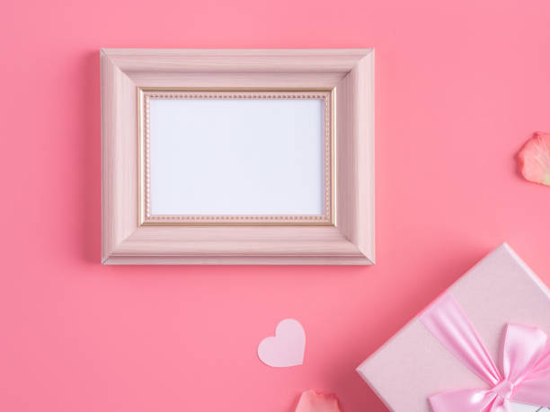 istock Valentine's Day design concept background with pink petals and gift box. 1296324029
