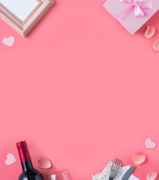 istock Valentine's Day design concept background with pink petals and gift box. 1296324059