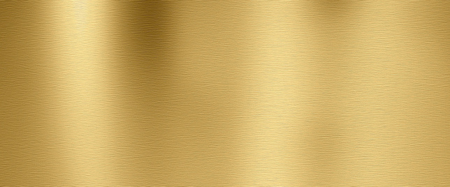 Golden shiny metal surface with brushed structure