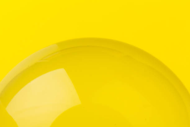 istock Crystal, transparent ball, sphere on a yellow background. 1296326261