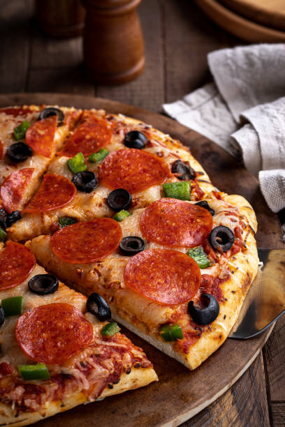 istock Pizza With Pepperoni, Olives and Peppers 1296326430