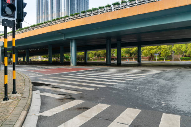 istock Concrete structure and asphalt road space under the overpass in the city 1296326509