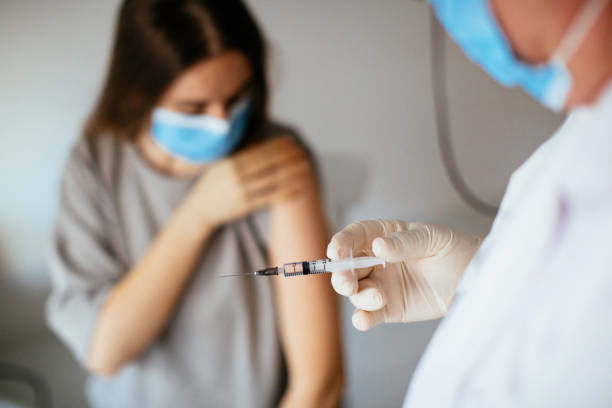 istock Young women receiving coronavirus vaccine 1296327833